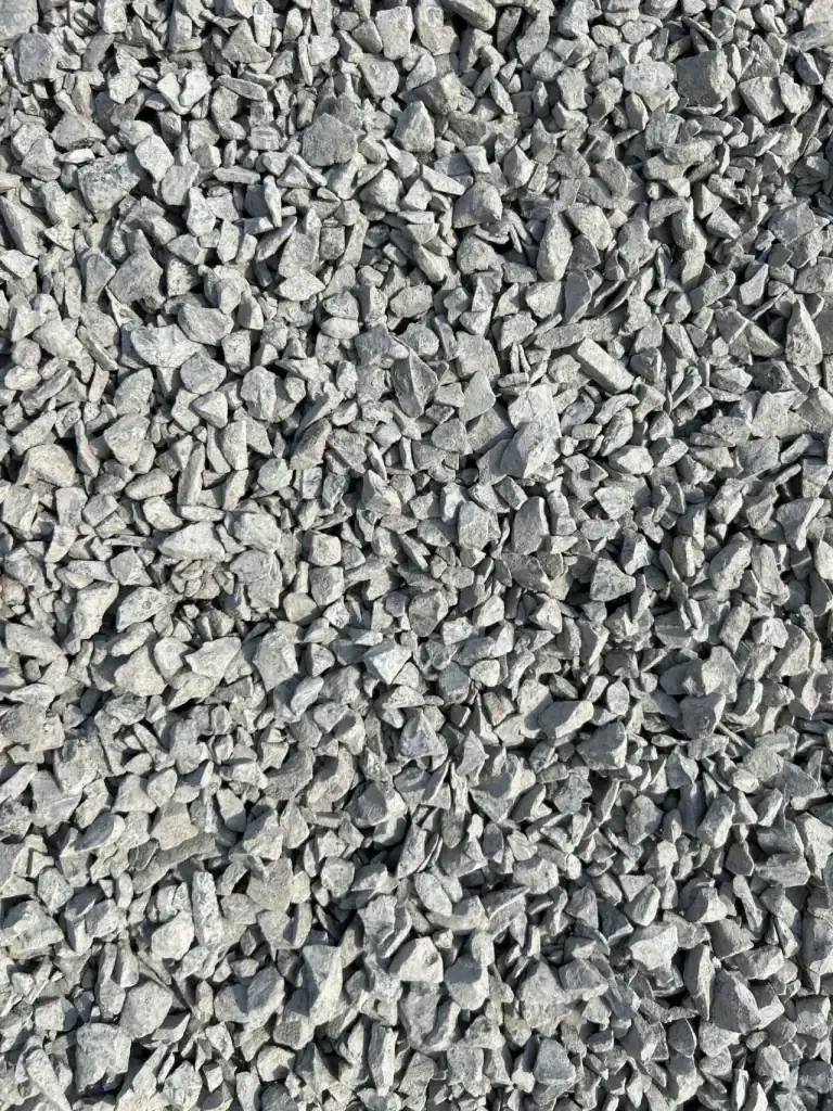 Angular crushed stone is best for sandy pool backfills.