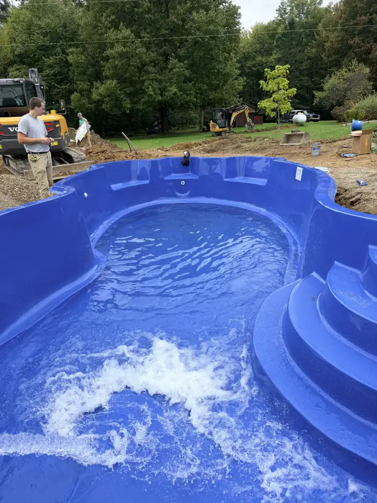 Fiberglass pool filling with water during installation